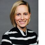 Image of Jessica Mertz, new executive director of Clery Center. Jessica is Caucasian with short straight blond hair. Her shirt is black with white horizontal stripes.